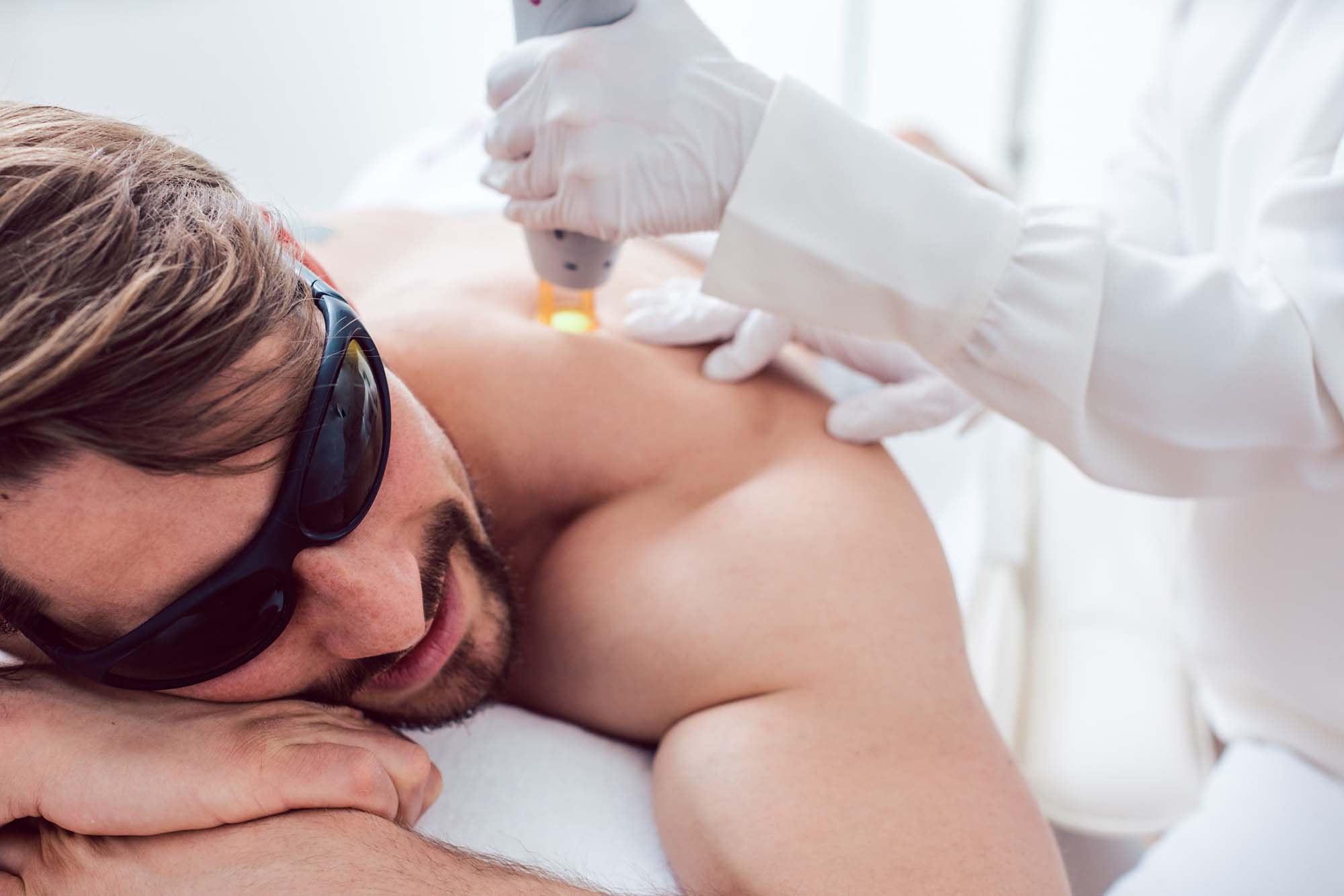Man in a hair removal studio Man in a hair removal studio