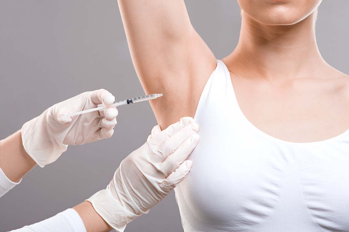 Woman receiving underarm treatment against hyperhidrosis, closeup